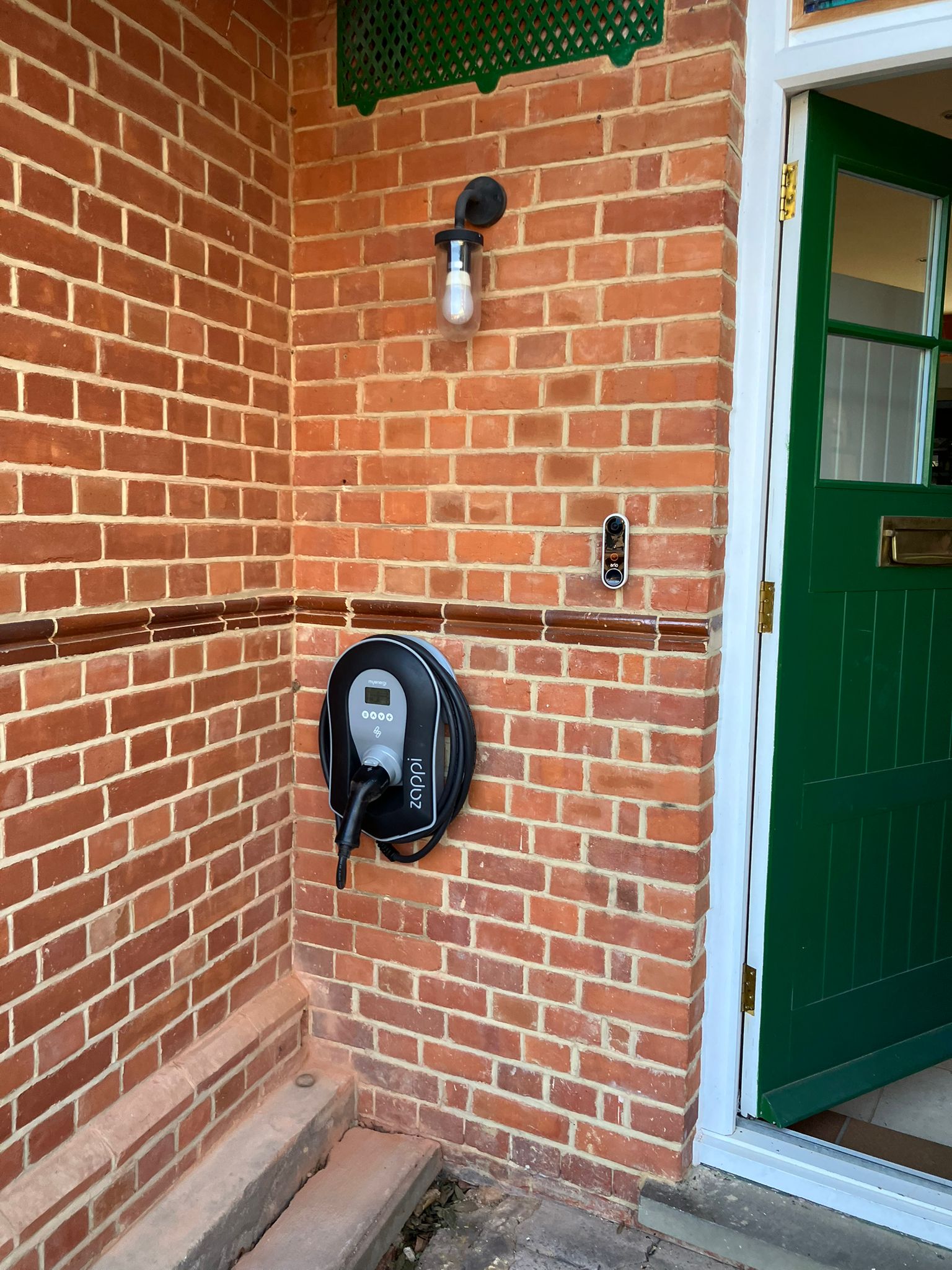 EV charger installed on a brick wall by Nash Electrical Solutions